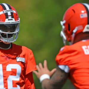 Cleveland Browns quarterback Shedeur Sanders (12) watches quarterback Dillon Gabriel (5) during day two of rookie minicamp May 10, 2025, in Berea, Ohio.