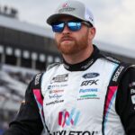 NASCAR Cup Series driver Chris Buescher walks on pit road during practice and qualifying for The Great American Getaway 400 at Pocono Raceway.