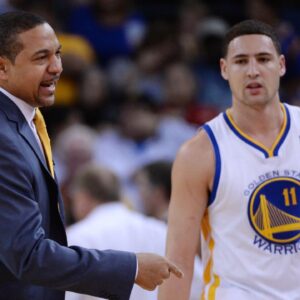 Golden State Warriors head coach Mark Jackson (left) instructs in front of shooting guard Klay Thompson (11) against the Denver Nuggets during the first quarter at Oracle Arena.