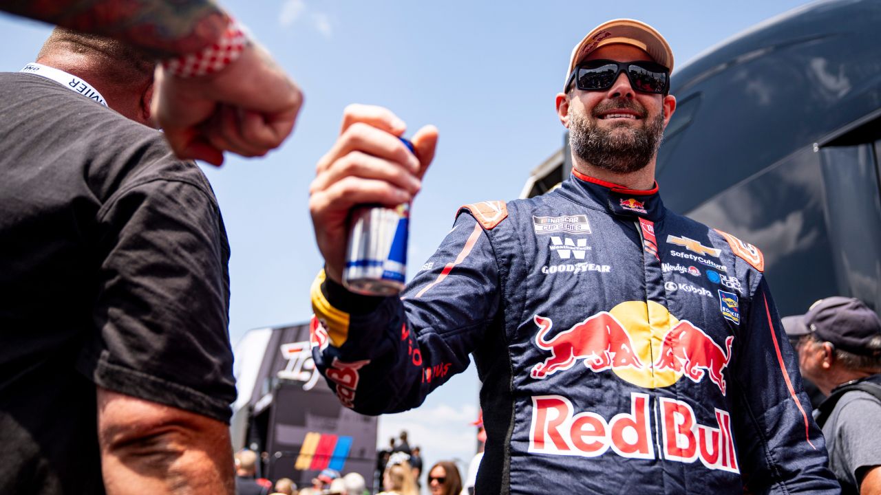 Shane Van Gisbergen (88) fist bumps a fan before the NASCAR Cup Series Iowa Corn 350 on Aug. 3, 2025, at Iowa Speedway in Newton, Iowa.