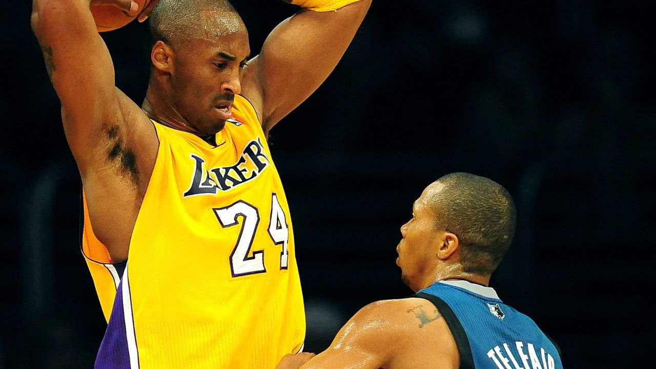 Los Angeles Lakers shooting guard Kobe Bryant (24) controls the ball against the defense of Minnesota Timberwolves point guard Sebastian Telfair (3) during the first half at the Staples Center.