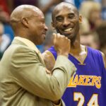 Los Angeles Lakers guard Kobe Bryant (24) laughs with head coach Byron Scott against the Minnesota Timberwolves at Target Center. The Lakers defeated the Timberwolves 100-94.