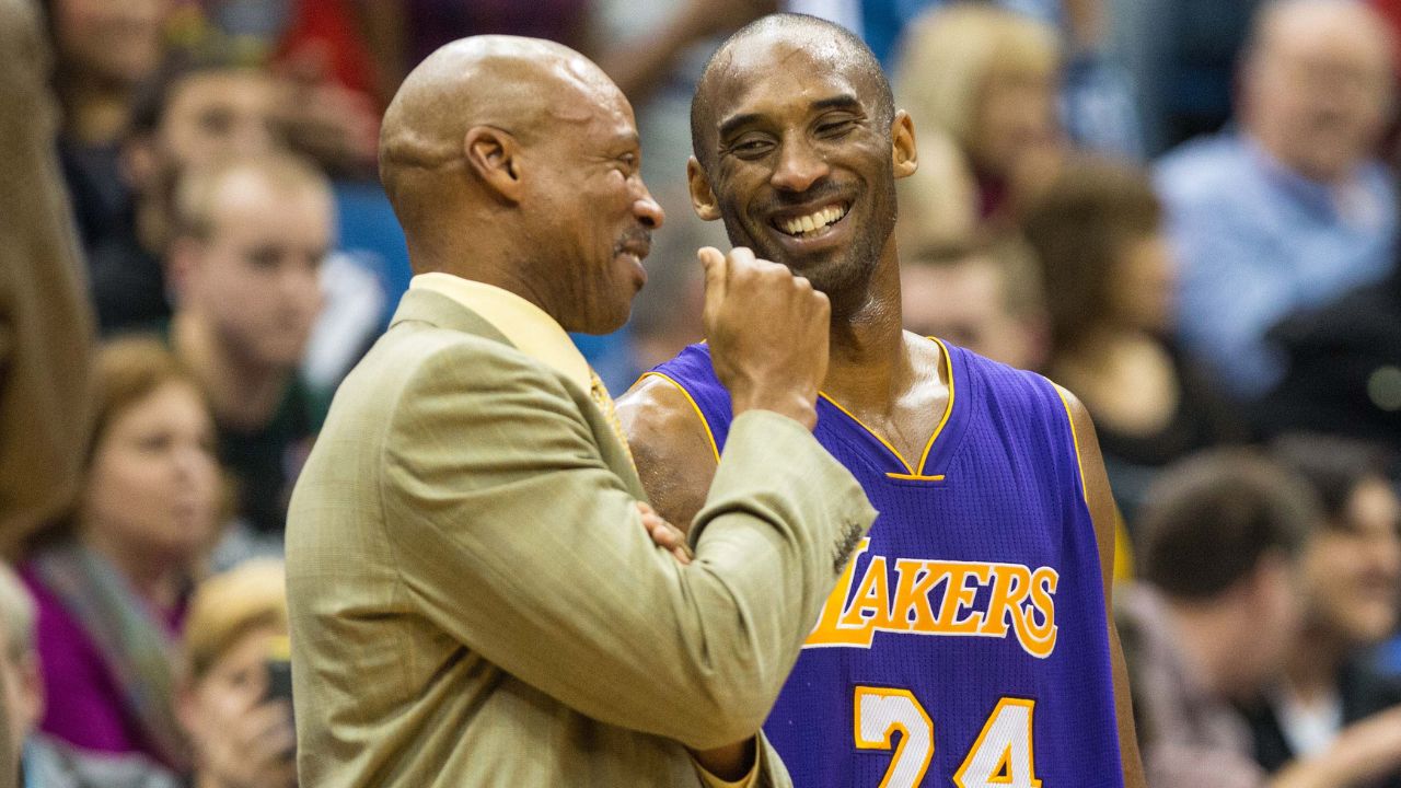 Los Angeles Lakers guard Kobe Bryant (24) laughs with head coach Byron Scott against the Minnesota Timberwolves at Target Center. The Lakers defeated the Timberwolves 100-94.