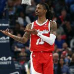 Apr 1, 2025; Memphis, Tennessee, USA; Memphis Grizzlies guard Ja Morant (12) reacts after a basket during the second quarter against the Golden State Warriors at FedExForum.