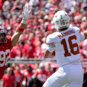 Texas Longhorns quarterback Arch Manning (16) throws the ball against Ohio State Buckeyes defensive end Caden Curry (92) in the first quarter of their game at Ohio Stadium in Columbus, Ohio on Aug 30, 2025.