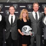 Jon Gruden and wife Cindy Gruden pose with sons Deuce Gruden, Michael Gruden and Jon Gruden III pose at press conference after being introduced as Oakland Raiders head coach at the Raiders headquarters.