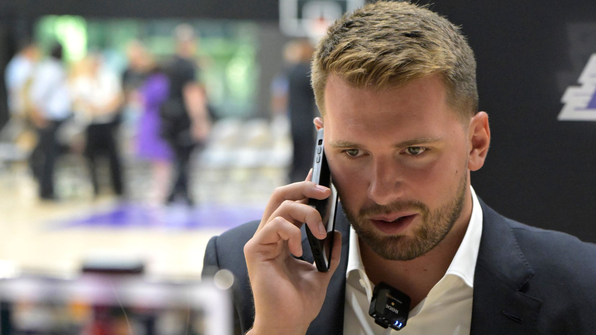 Caption: Aug 2, 2025; El Segundo, CA, USA; Los Angeles Lakers Luka Doncic (77) is interviewed by ESPN LA radio following a press conference announcing the signing of a 3-year, $165 million contract extension at UCLA Health Training Center.