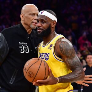 Former Los Angeles Lakers player Kareem Abdul-Jabbar hugs forward LeBron James (6) after James becomes the all time NBA scoring leader againt the Oklahoma City Thunder during the second half at Crypto.com Arena