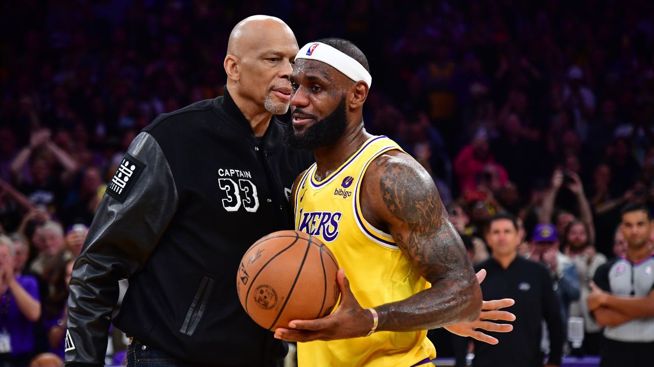 Former Los Angeles Lakers player Kareem Abdul-Jabbar hugs forward LeBron James (6) after James becomes the all time NBA scoring leader againt the Oklahoma City Thunder during the second half at Crypto.com Arena