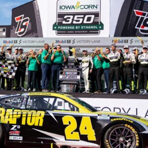 William Byron (24), crew members and sponsors pose for pictures after the NASCAR Cup Series Iowa Corn 350 on Aug. 3, 2025, at Iowa Speedway in Newton, Iowa. Byron (24) finished the race first.