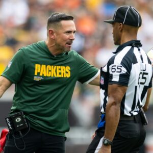 Green Bay Packers head coach Matt LaFleur argues a call with line judge Walt Coleman IV (65) during the fourth quarter at Huntington Bank Field.