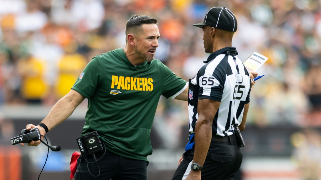 Green Bay Packers head coach Matt LaFleur argues a call with line judge Walt Coleman IV (65) during the fourth quarter at Huntington Bank Field.