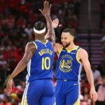 Golden State Warriors guard Stephen Curry (30) celebrates with forward Jimmy Butler III (10) after a play during the third quarter against the Houston Rockets at Toyota Center