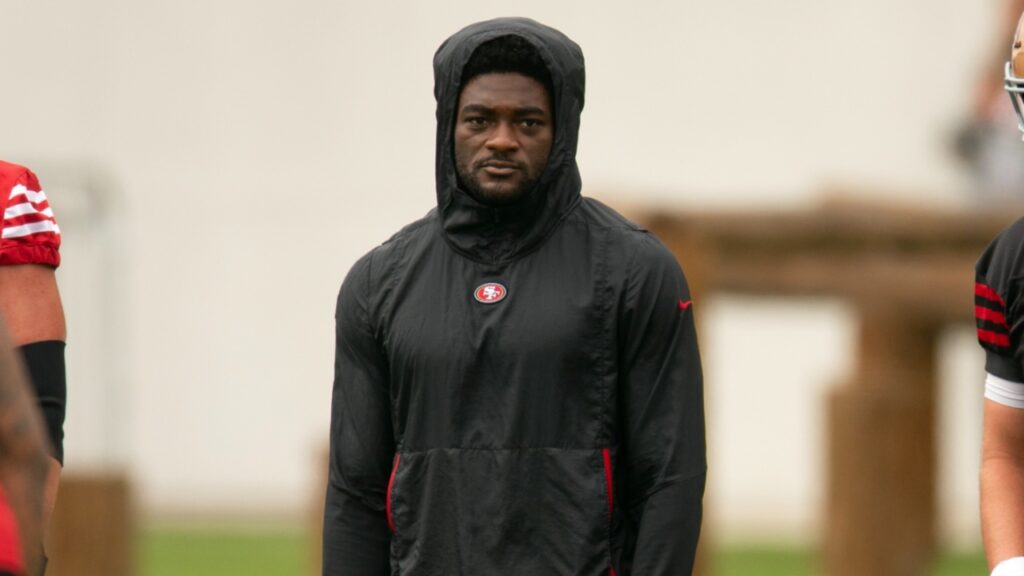 San Francisco 49ers wide receiver Brandon Aiyuk (in black hoodie) watches his teammates work out during the second day of training camp.