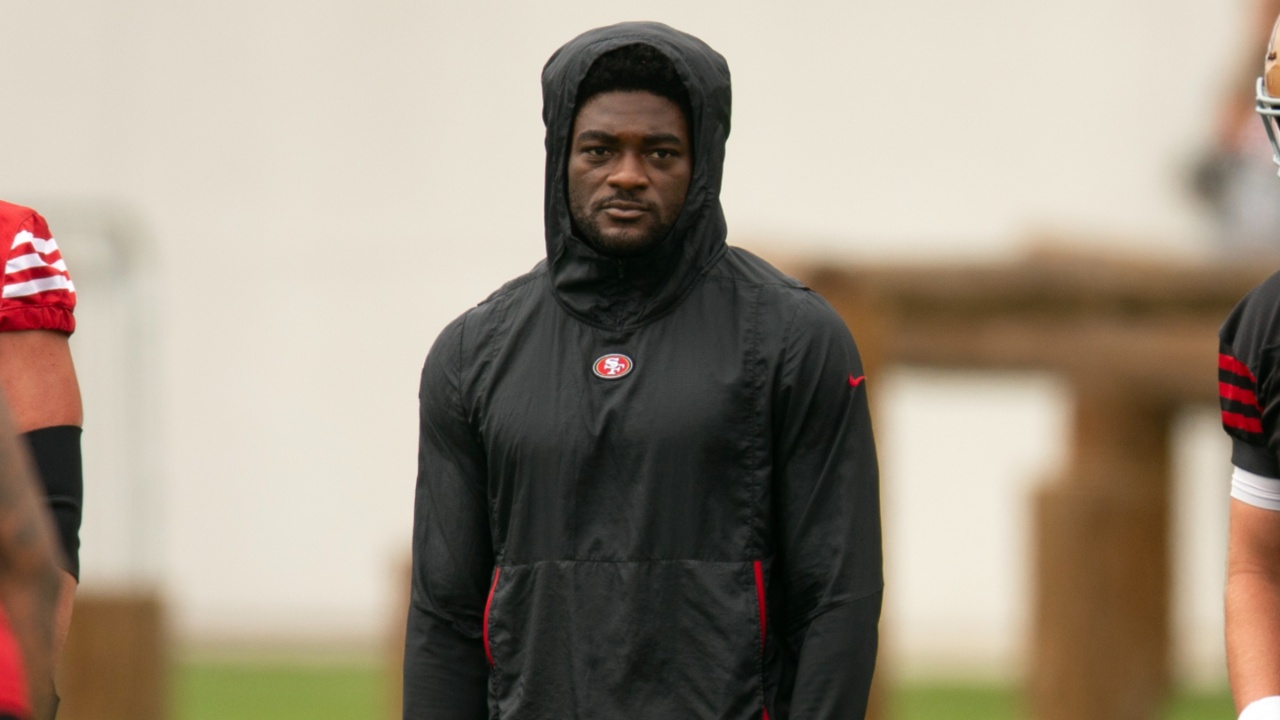 San Francisco 49ers wide receiver Brandon Aiyuk (in black hoodie) watches his teammates work out during the second day of training camp.