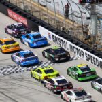 The green flag is waved to start the NASCAR Food City 500 at Bristol Motor Speedway.
