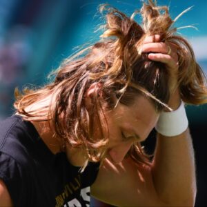 Jacksonville Jaguars quarterback Trevor Lawrence (16) runs hand through his hair before the game against the Miami Dolphins at Hard Rock Stadium.