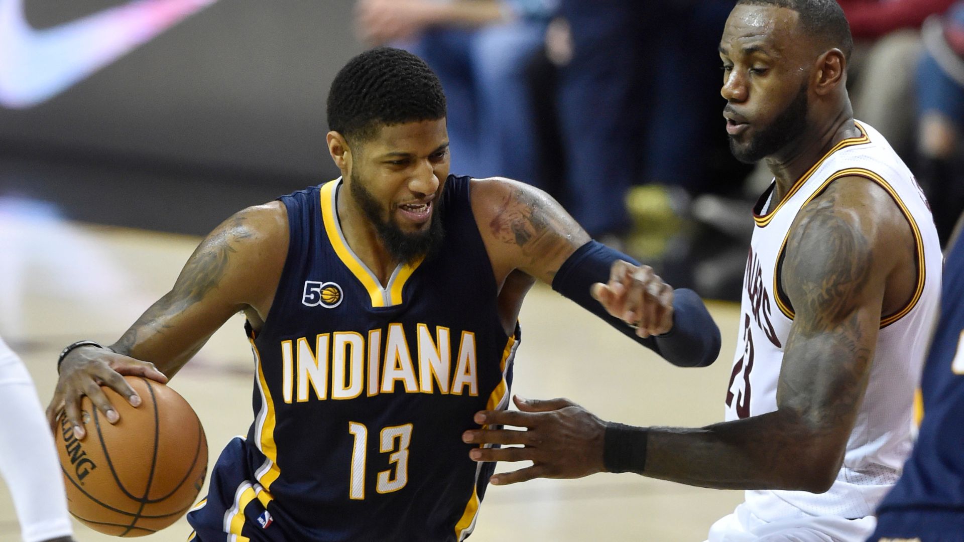 Apr 2, 2017; Cleveland, OH, USA; Indiana Pacers forward Paul George (13) drives against Cleveland Cavaliers forward LeBron James (23) in the second quarter at Quicken Loans Arena.