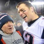 New England Patriots head coach Bill Belichick and quarterback Tom Brady (12) celebrate the win over the Kansas City Chiefs during overtime in the AFC Championship game at Arrowhead Stadium.