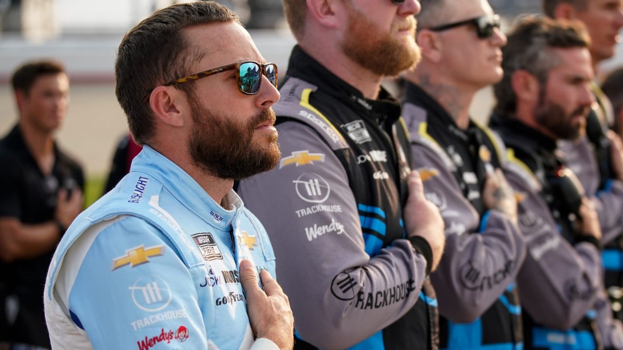 NASCAR Cup Series driver Ross Chastain stands with his team during the national anthem before the Cracker Barrel 400 at Nashville Superspeedway in Lebanon, Tenn., Sunday, June 1, 2025.