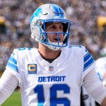 Detroit Lions quarterback Jared Goff (16) cheers up teammates on the sideline before a first down against Green Bay Packers during the first half at Lambeau Field in Green Bay, Wis., on Sunday, September 7, 2025.
