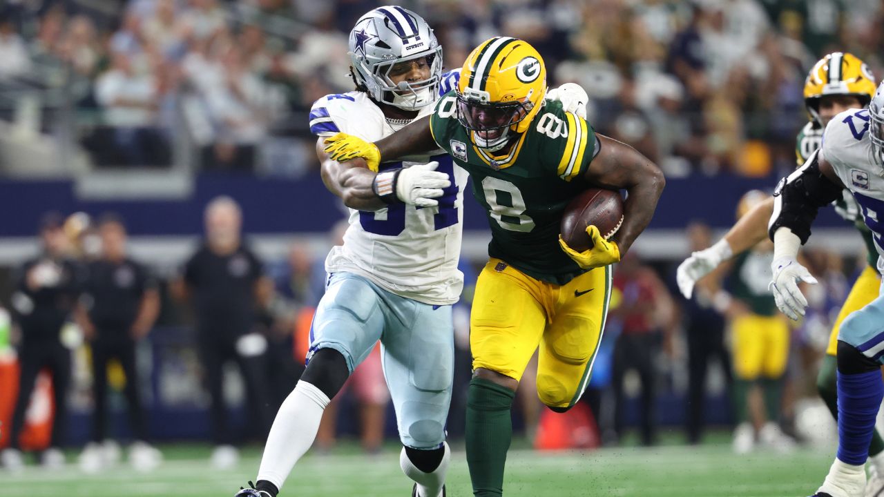 Packers running back Josh Jacobs and Cowboys defensive end Sam Williams