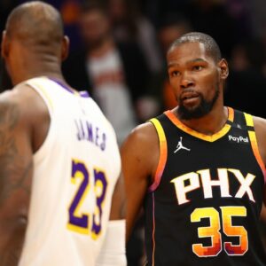 Phoenix Suns forward Kevin Durant (35) looks at Los Angeles Lakers forward LeBron James (23) during the third quarter at Footprint Center.