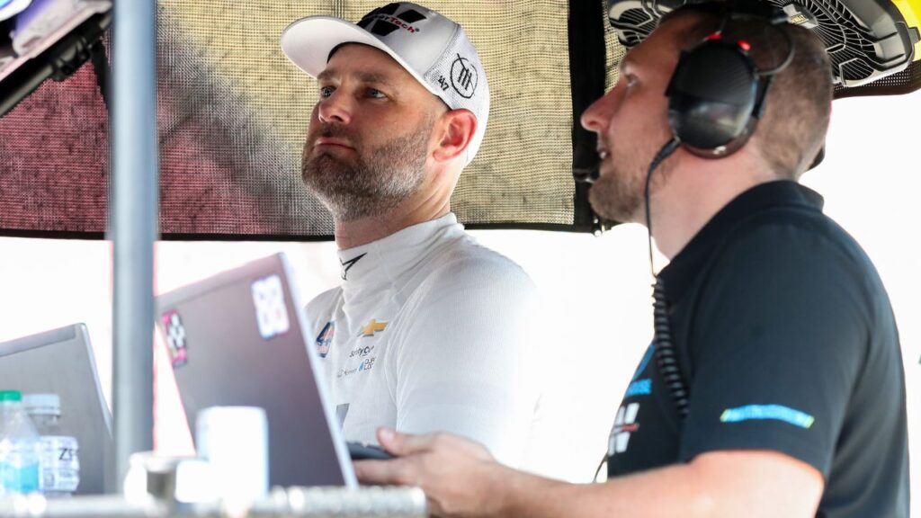 NASCAR Cup Series driver Shane Van Gisbergen (left) looks at a computer monitor on pit road during practice and qualifying for the Go Bowling at The Glen at Watkins Glen International.