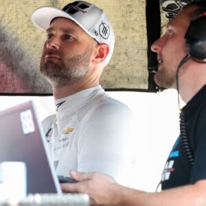 NASCAR Cup Series driver Shane Van Gisbergen (left) looks at a computer monitor on pit road during practice and qualifying for the Go Bowling at The Glen at Watkins Glen International.