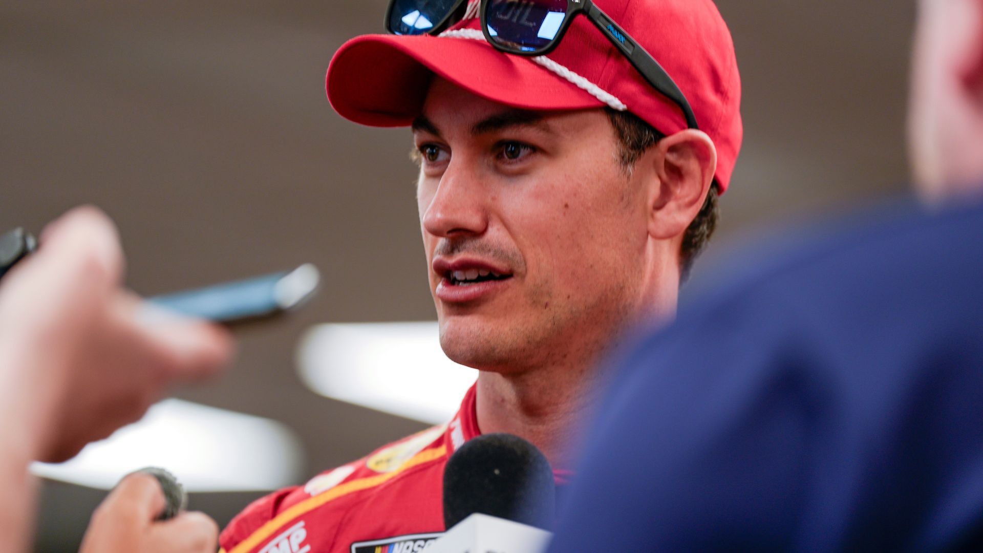 Apr 5, 2025; Darlington, South Carolina, USA; NASCAR Cup Series driver Joey Logano (22) talks with media at Darlington Raceway.