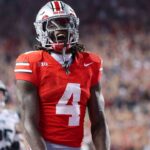Ohio State Buckeyes wide receiver Jeremiah Smith (4) celebrates his touchdown during the second half against the Ohio Bobcats at Ohio Stadium.