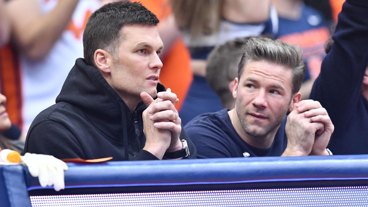 New England Patriots quarterback Tom Brady (left) and wide receiver Julian Edelman attend a game between the Syracuse Orange and the North Carolina Tar Heels at the Carrier Dome.