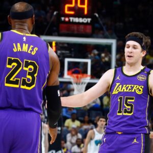 Mar 29, 2025; Memphis, Tennessee, USA; Los Angeles Lakers guard Austin Reaves (15) reacts with forward LeBron James (23) during the second quarter against the Memphis Grizzlies at FedExForum