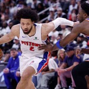Detroit Pistons guard Cade Cunningham (2) dribbles defended by New York Knicks forward OG Anunoby (8) in the second half during game six of first round for the 2024 NBA Playoffs at Little Caesars Arena.