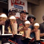 Jun 16, 1997; Chicago, IL, USA; Chicago Bulls players, left to right, Ron Harper, Dennis Rodman, Scottie Pippen, Michael Jordan & coach Phil Jackson hold up the Bulls' five championship trophies at a rally in Grant Park. Mandatory Credit: Anne Ryan-USA TODAY