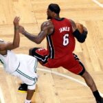 Boston Celtics point guard Rajon Rondo (9) fouls Miami Heat small forward LeBron James (6) during the second half in game six of the Eastern Conference finals of the 2012 NBA playoffs at TD Garden.