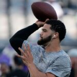 Chicago Bears quarterback Caleb Williams (18) practices before the game at Soldier Field.