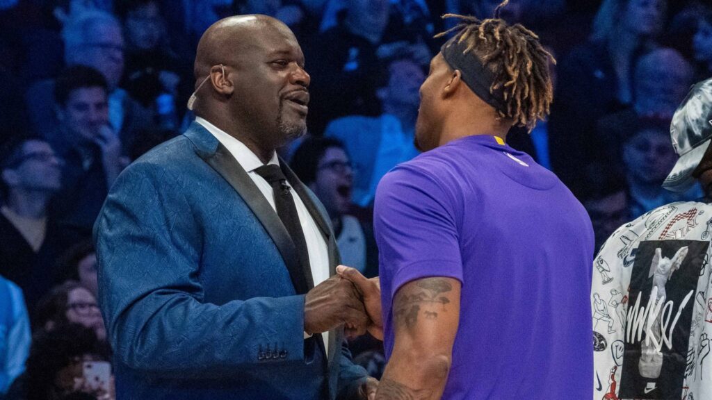 February 15, 2020; Chicago, Illinois, USA; NBA great Shaquille O'Neal (left) shakes hands with Los Angeles Lakers player Dwight Howard (right) during NBA All Star Saturday Night at United Center.