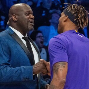 February 15, 2020; Chicago, Illinois, USA; NBA great Shaquille O'Neal (left) shakes hands with Los Angeles Lakers player Dwight Howard (right) during NBA All Star Saturday Night at United Center.