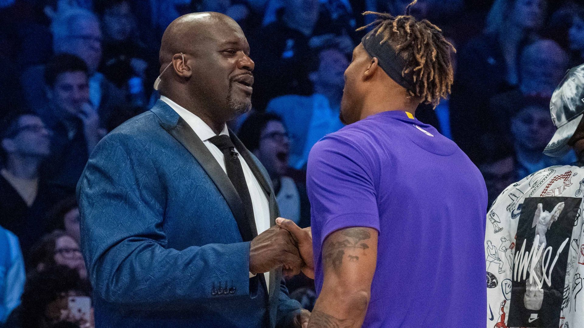 February 15, 2020; Chicago, Illinois, USA; NBA great Shaquille O'Neal (left) shakes hands with Los Angeles Lakers player Dwight Howard (right) during NBA All Star Saturday Night at United Center.