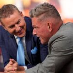 Pat McAfee, right, talks to Kirk Herbstreit on the set of ESPN College GameDay prior to the NCAA football game between the Ohio State Buckeyes and the Texas Longhorns at Ohio Stadium on Aug. 30, 2025.