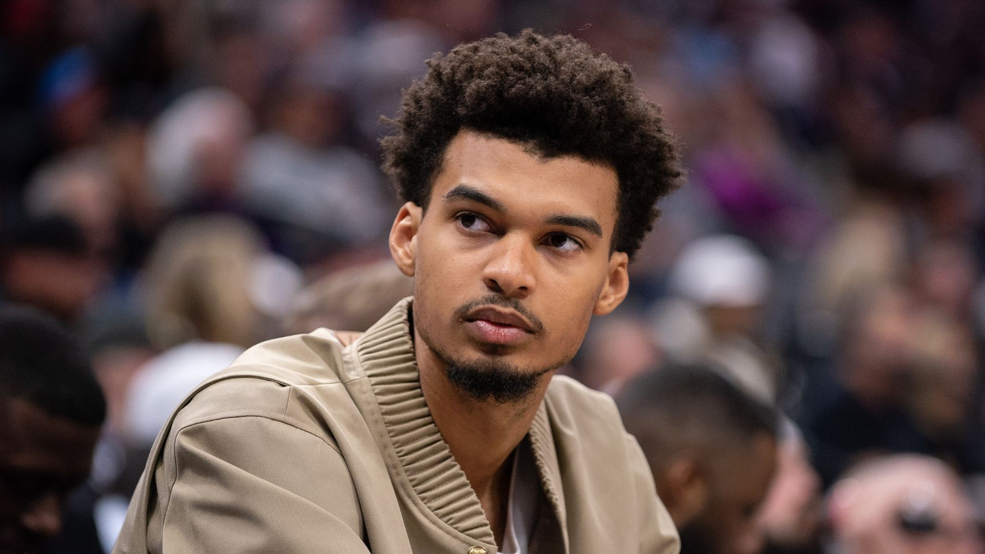 Mar 7, 2025; Sacramento, California, USA; San Antonio Spurs center Victor Wembanyama (1) looks on from the bench during the fourth quarter of the game against the Sacramento Kings at Golden 1 Center.