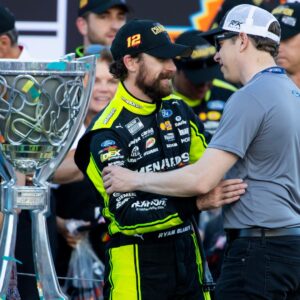 Nov 5, 2023; Avondale, Arizona, USA; NASCAR Cup Series driver Ryan Blaney (left) is congratulated by Brad Keselowski as he celebrates after winning the 2023 NASCAR Cup Series Championship at Phoenix Raceway