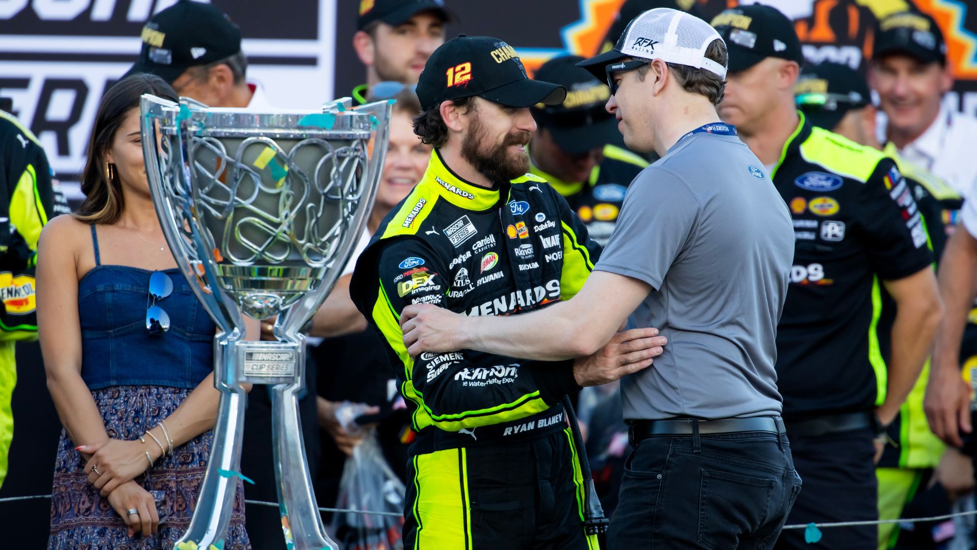 Nov 5, 2023; Avondale, Arizona, USA; NASCAR Cup Series driver Ryan Blaney (left) is congratulated by Brad Keselowski as he celebrates after winning the 2023 NASCAR Cup Series Championship at Phoenix Raceway