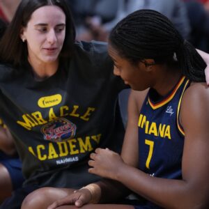 Aug 5, 2025; Los Angeles, California, USA; Indiana Fever guard Caitlin Clark (22) gives a hug to forward Aliyah Boston (7) in the first half against the LA Sparks at Crypto.com Arena.