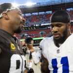 Cleveland Browns defensive end Myles Garrett (95) congratulates Dallas Cowboys linebacker Micah Parsons (11) after the game at Huntington Bank Field.