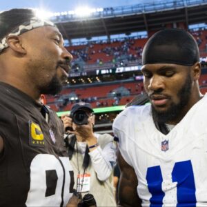 Cleveland Browns defensive end Myles Garrett (95) congratulates Dallas Cowboys linebacker Micah Parsons (11) after the game at Huntington Bank Field.