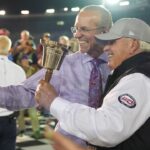 Former NASCAR Cup Series driver Kyle Petty takes a selfie in victory lane with car owner Rick Hendrick in victory lane after the Bass Pro Shops Night Race at Bristol Motor Speedway.