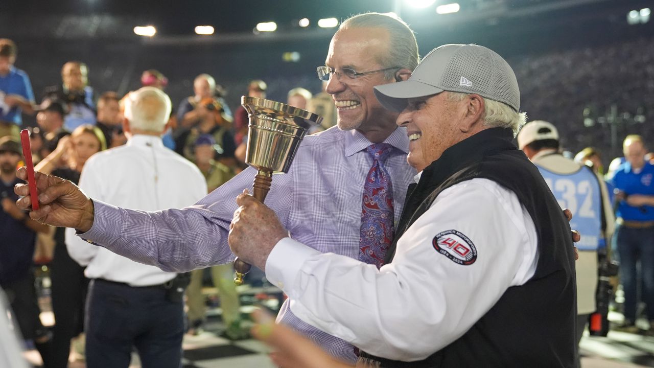 Former NASCAR Cup Series driver Kyle Petty takes a selfie in victory lane with car owner Rick Hendrick in victory lane after the Bass Pro Shops Night Race at Bristol Motor Speedway.