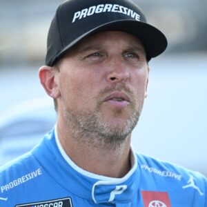 Sep 6, 2025; Madison, Illinois, USA; NASCAR Cup Series driver Denny Hamlin (11) looks on during practice and qualifying for the Enjoy Illinois 300 at World Wide Technology Raceway